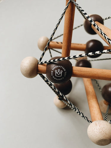 Skwish Rattle in Dark Brown from Manhattan Toy Company